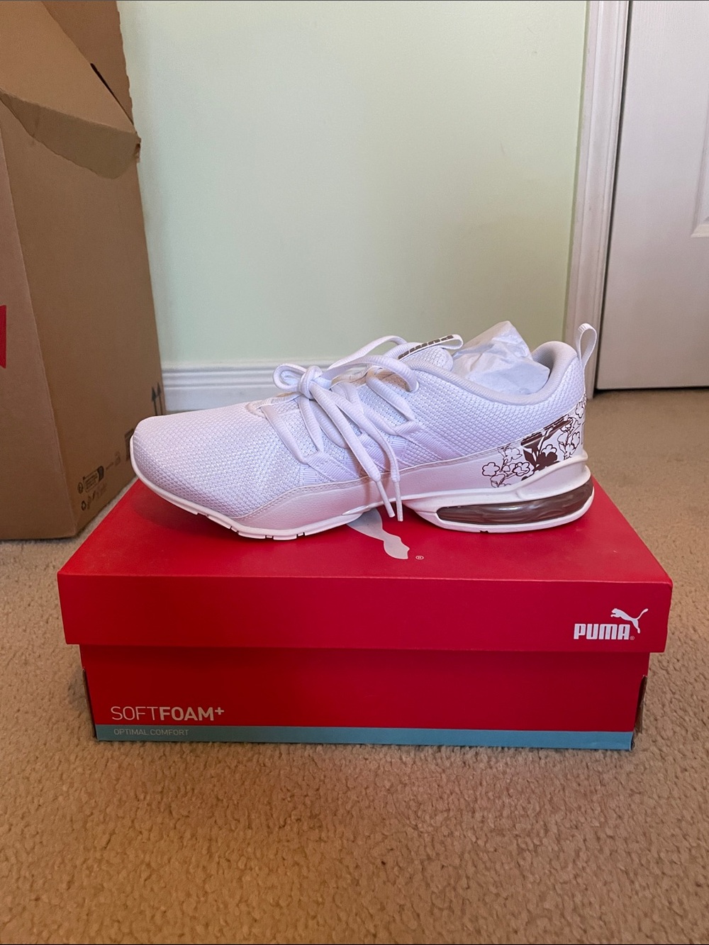 Puma White women’s Athletic Sneakers with Brown Floral Accent